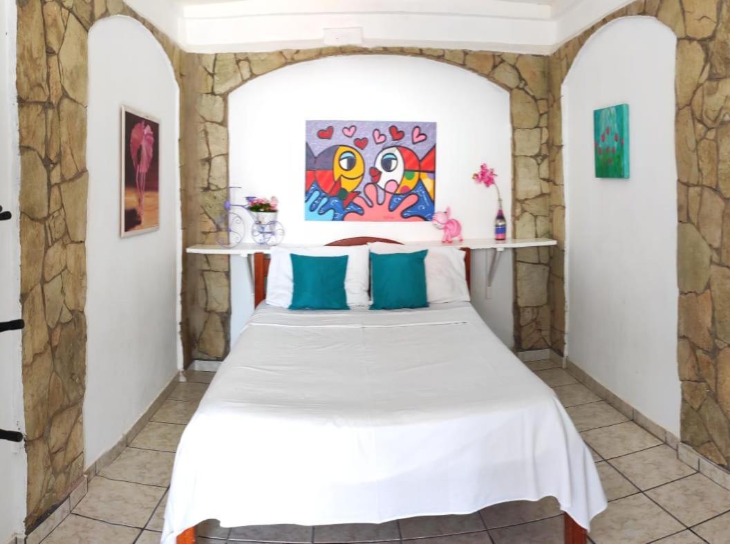 Quarto Triplo com Vista para a Piscina